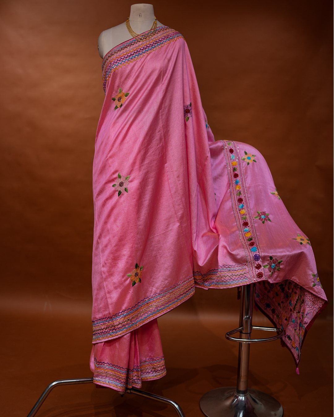 Pink Hand-Embroidered Floral Saree with Multicolour Zigzag Border — full drape, view one